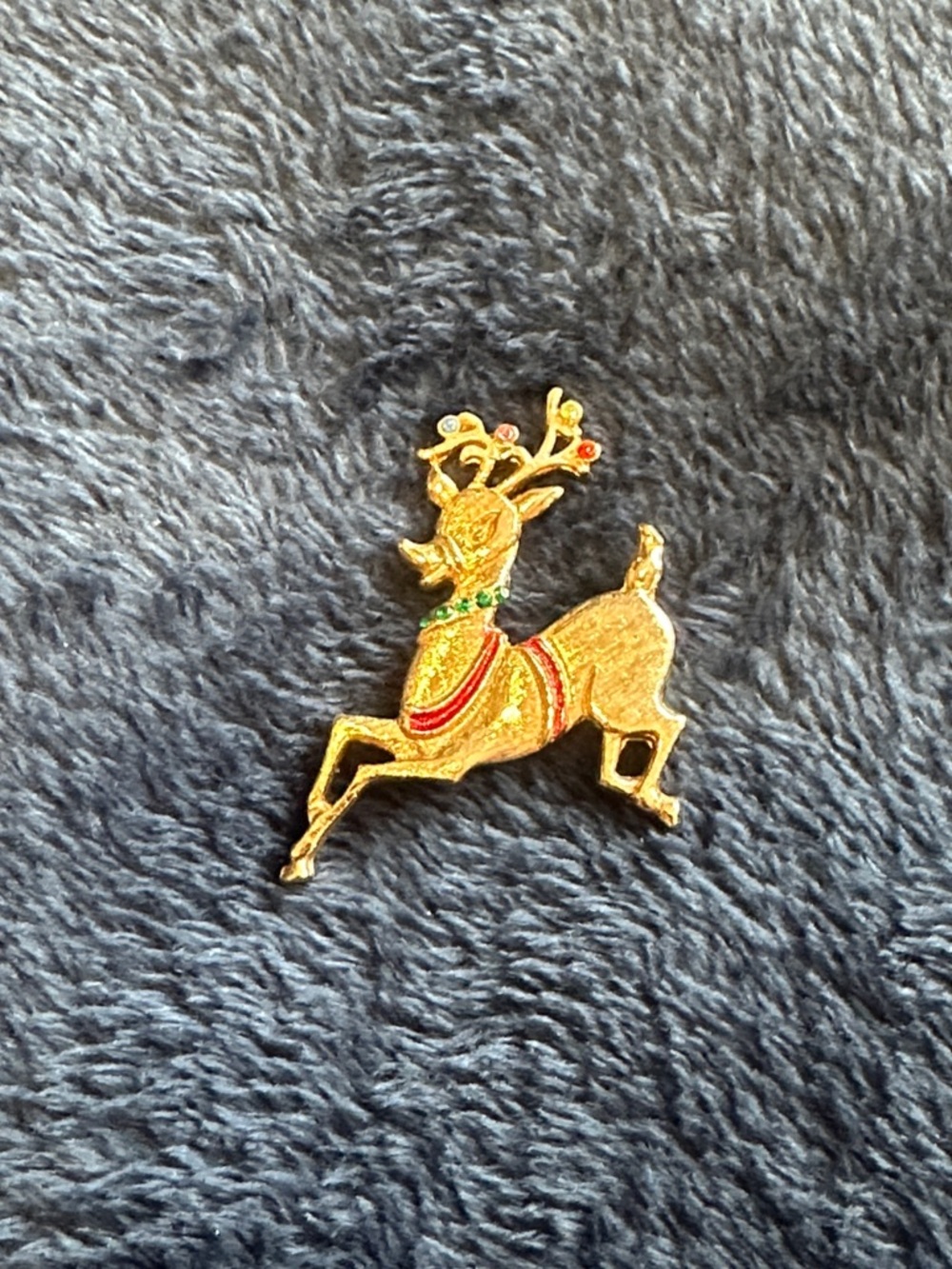 Vintage signed Gold-tone Reindeer Holiday Brooch with Red and Green Accents